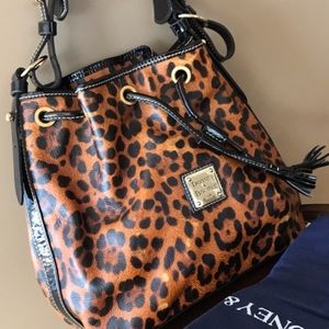 DOONEY & BOURKE leopard print bucket shoulder bag. Red interior.